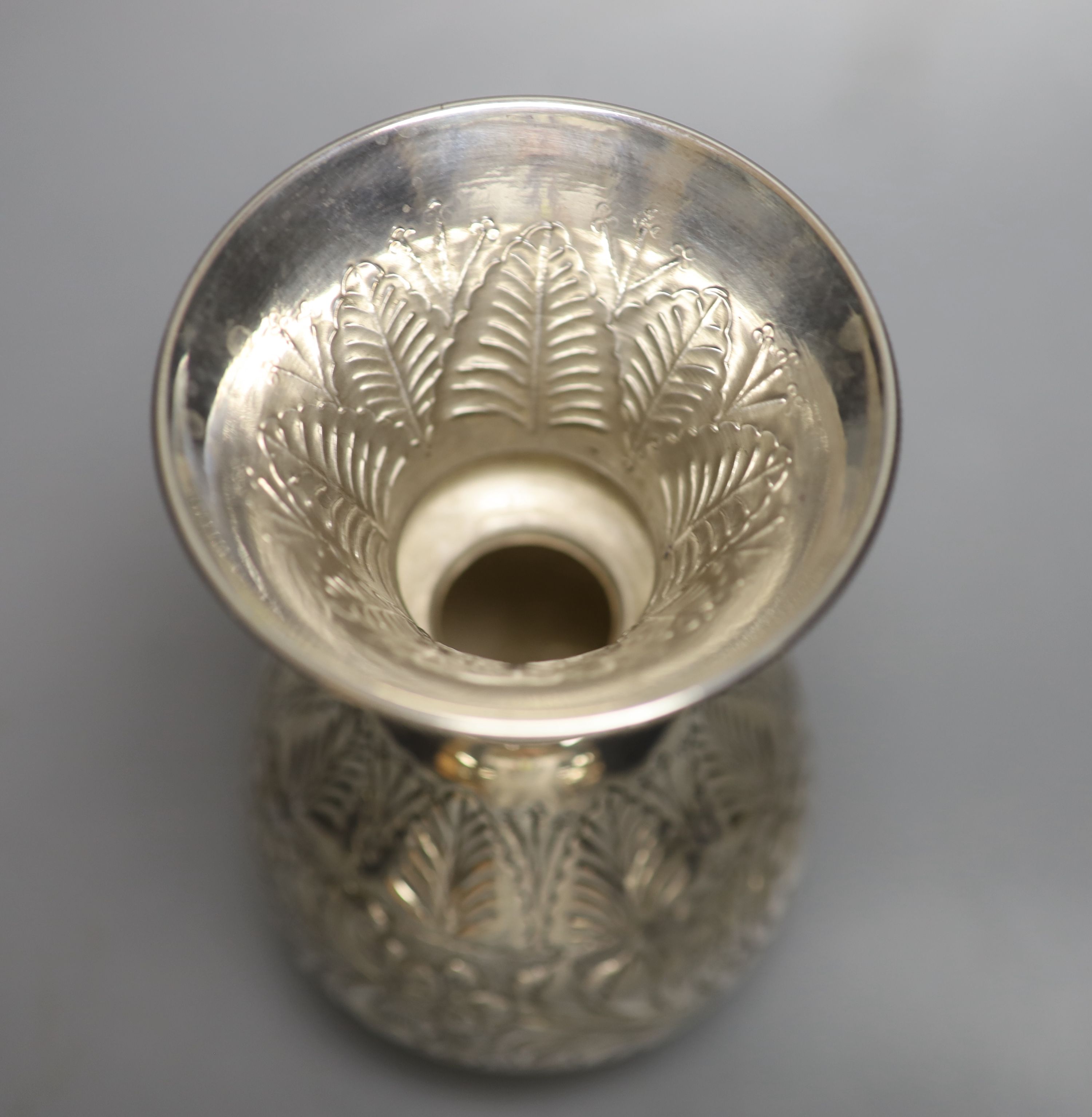 A post 1946 Egyptian embossed white metal baluster vase, 17.5cm,